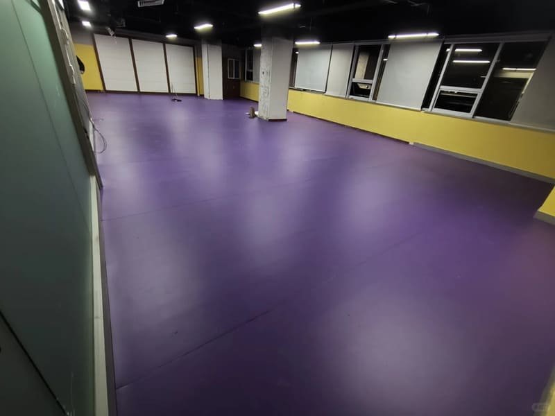 Fiberglass mesh reinforcement layer embedded in PVC flooring